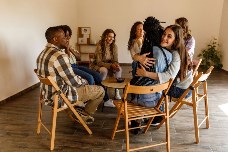 Diverse group sitting in a circle in a support group session
